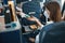 Cabin attendant giving woman pack of tissues and candy bar