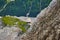 Cabin of the cable car to the Zugspitze in Bavaria hangs from the thick steel cable over the bare rocks of the Limestone Alps