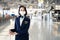 Cabin crew or air hostess wearing face mask walking in airport terminal to the airplanel during the COVID pandemic to prevent coro