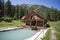Cabin on the edge of a lake, Wooden two-storey cottage. Cabin in the woods. The tourist base for a stay in the forest.