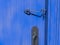 Cabin hook latch on a blue door