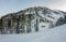 Cabin house chalets in winter forest with snow