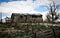 Cabin Leaning From Decay In Woods