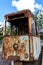 Cabin of old rusty destroyed tram outdoors