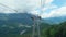 cabin of ropeway passes over mountains