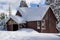 Cabin With Snow Piled Up On Roof