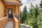 Cabin style home entrance with long walkway and railings.
