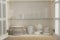 Cabinet with crockery and glassware. Order in kitchen