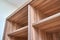 Cabinet of walnut solid veneer in empty walk-in closet