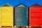 Cabins changers for bathers on a beach of the Mediterranean in summer, colored blue, yellow and red