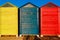 Cabins changers for bathers on a beach of the Mediterranean in summer, colored blue, yellow and red