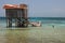 Cabins on stilts on the small island of Tobacco Caye, Belize