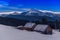 Cabins under moonlight in winter