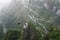 Cable car above winding road in Tianmen mountain, China