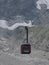 Cable car cabin on AIGUILLE DU MIDI at highest french mountains range in european ALPS landscape - vertical