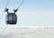 Cable car cabin going up above the clouds to the very top of a mountain at a ski resort