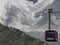 Cable car cabin with tourists on AIGUILLE DU MIDI at highest french mountains range in european ALPS landscape