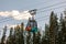 Cable car gondolas travelling up and down Sulphur Mountain in Banff