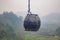 Cable Car on Green Epic Scenery Background. Cable Cabin on Ropeway on Green Landscape