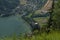 Cable car Kanzelhohe in green needles forest in summer sunny day