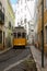 Cable car in a narrow street in Lisbon