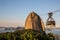 Cable car with tourists coming down from Sugarloaf mountain at sunset in the Urca neighbourhood of Rio de Janeiro, Brazil