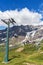 Cable cars near Cervino Mountain - Italy. Meadow, nature and a beautiful cloudy sky