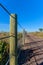 Cable fence along gravel road