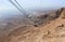 Cable funicular cable leading to the lower station at the foot of the hill on which Masada fortress is located in the Judean deser