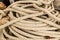 Cable long dark beige natural jute closeup marine background