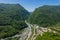 Cable-Stayed Bridge on the Adler-Krasnaya Polyana motorway. Aerial view of car driving along the winding mountain road