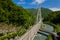 Cable-Stayed Bridge on the Adler-Krasnaya Polyana motorway. Aerial view of car driving along the winding mountain road