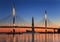 The cable-stayed bridge over Petrovsky fairway and the tower of Lakhta center, at sunset, Saint-Petersburg