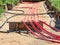 Cables with red electrical insulation lay underground near the distribution building