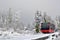 Cableway cabin on rails in mountains in fog