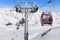 Cableway lift cable cars, gondola cabins on winter snowy mountains background beautiful scenery.