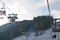 Cableway lift gondola cabins on winter snowy mountains background beautiful scenery