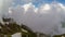 Cableway in mountains against the clouds sky