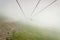 Cableway in the mountains on foggy day. alpine landscape