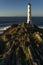 Cabo (cape) Home lighthouse on the cliffs at sunset in Rias Baixas zone in Galicia coast