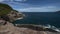 Cabo Frio, Rio de Janeiro - Brazil. Panoramic view from above - Praia da Concha, Coastal vegetation, mountains, waves hitting the