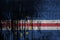 Cabo verde flag depicted in paint colors on old and dirty oil barrel wall closeup. Textured banner on rough background