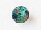 cabochon from Chrysocolla gemstone on white