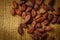 Cacao beans on burlap background