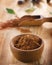 Cacao powder in a wooden bowl.