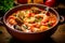 Cacciucco - Tuscan fish stew made with various types of seafood, tomatoes, and garlic