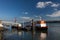 A cacilheiro boat in the city of Lisbon, Portugal, with the 25 of April bridge on the background;