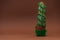 Cactus as Christmas tree with green ball garland on browm background. Christmas and New Year holidays celebration concept. Front