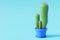 Cactus in cartoon minimal style with a blue background.