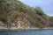 Cactus and scrub brush on the shoreline of The Bight, Norman Island, BVI